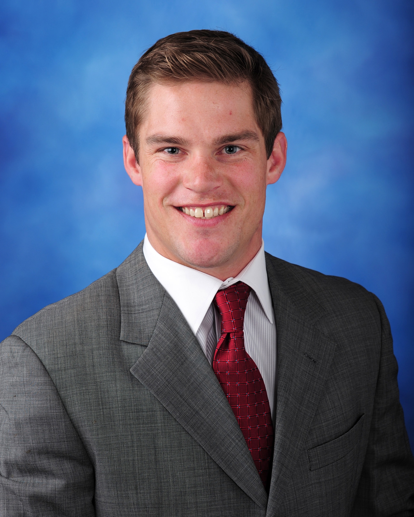 man standing beside wall